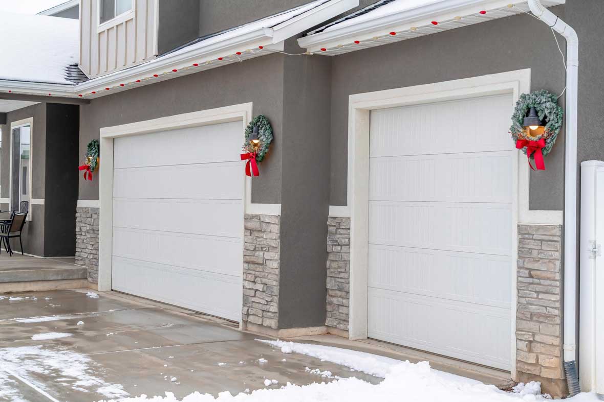 Garage with Driveway with Snow — Northfield, IL — Raynor Door Company